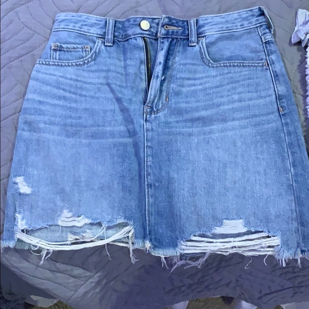 Jean skirt with a few rips in it